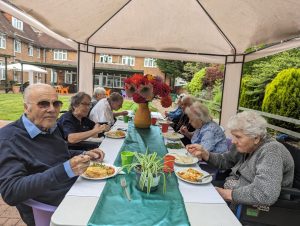 Residents eating in the garden